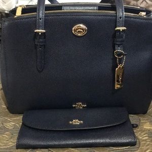 Coach Handbag with matching wallet set.